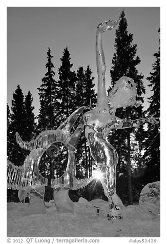 Sun setting over ice sculpture, World Ice Art Championships. Fairbanks, Alaska, USA (black and white)