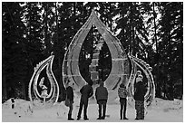 Tourists looking at ice sculpture, 2012 World Ice Art Championships. Fairbanks, Alaska, USA ( black and white)