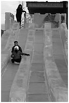 Lights come up inside ice slide at dusk. Fairbanks, Alaska, USA (black and white)