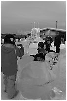 Children playing on ice sculptures, Ice Alaska. Fairbanks, Alaska, USA ( black and white)