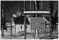 Welcome sign and church. North Pole, Alaska, USA (black and white)