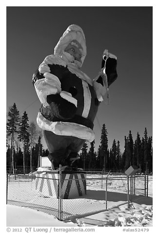 Santa Claus statue surrounded by barbed wire. North Pole, Alaska, USA (black and white)