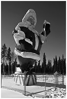 Santa Claus statue surrounded by barbed wire. North Pole, Alaska, USA (black and white)