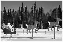 Santa Claus and reinder cut-out in winter. North Pole, Alaska, USA ( black and white)