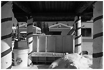 Bus stop with red candy-like stripped columns. North Pole, Alaska, USA ( black and white)