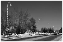 Main street and white street lights with red stripes. North Pole, Alaska, USA (black and white)