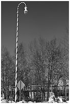 Street light decorated with a candy cane motif. North Pole, Alaska, USA ( black and white)