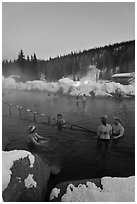 People soak in natural hot springs in winter. Chena Hot Springs, Alaska, USA ( black and white)