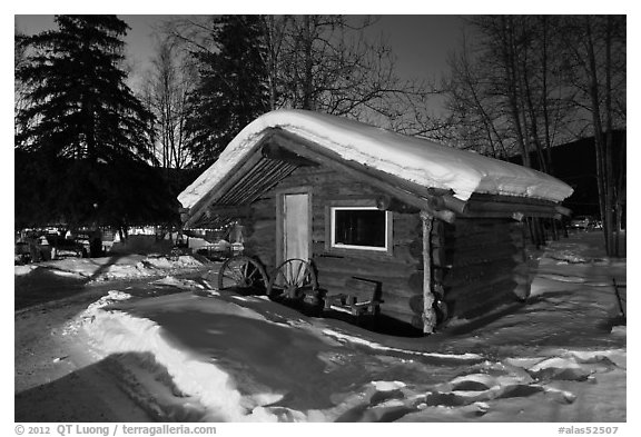 Snowy log cabin at night. Chena Hot Springs, Alaska, USA (black and white)