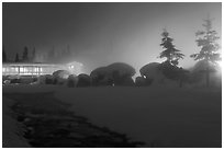 Stream, steam, and bathhouse at night. Chena Hot Springs, Alaska, USA ( black and white)