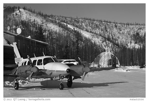 Plane with engine block warmers on frozen runway. Chena Hot Springs, Alaska, USA