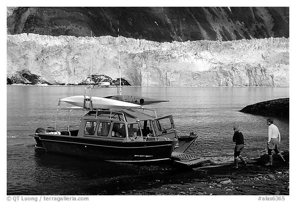 Water taxi boats lands on Black Sand Beach. Prince William Sound, Alaska, USA (black and white)