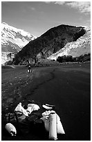 Kayaking gear on Black Sand Beach. Prince William Sound, Alaska, USA (black and white)