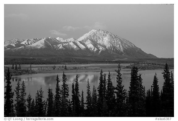 Purple mountains and lake at dusk. Alaska, USA