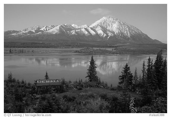 Mountains and lake at dusk, cabin with Denali sign. Alaska, USA (black and white)