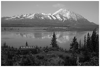 Mountains and lake at dusk, cabin with Denali sign. Alaska, USA (black and white)