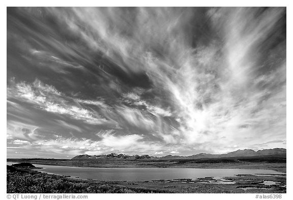 Clouds, tundra and lake along Denali Highway. Alaska, USA (black and white)