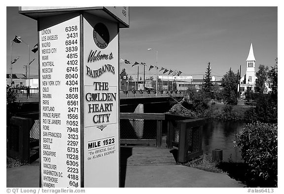 Sign showing distances to major cities on the globe in Fairbanks. Fairbanks, Alaska, USA (black and white)