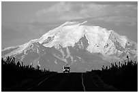 Car on Glenn Highway with Wrangell range peak behind. Alaska, USA ( black and white)