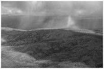 Aerial view of hillside in autumn with rain and rainbow. Alaska, USA ( black and white)
