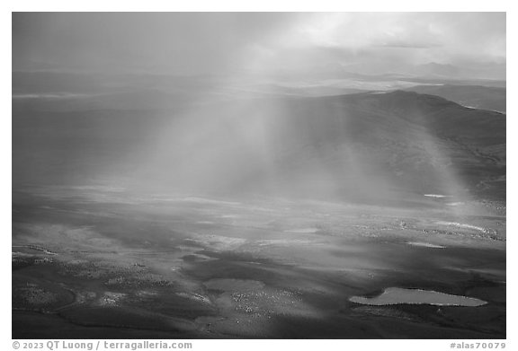 Aerial view of lakes, rainshowers, and rainbow. Alaska, USA (black and white)