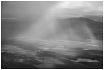 Aerial view of lakes, rainshowers, and rainbow. Alaska, USA ( black and white)