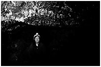 Caver inside a lava tube, Lava Beds National Monument. California, USA (black and white)