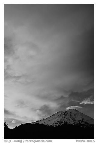 Clouds dramatically colored at sunset above Mt Shasta. California, USA