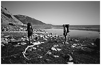 Backpackers cross a stream, Lost Coast. California, USA (black and white)