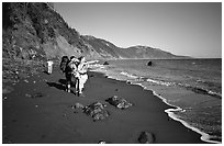 Backpackers on the beach,  Lost Coast. California, USA (black and white)