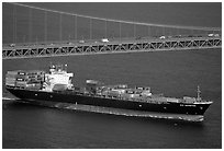 Container ship cruising under the Golden Gate Bridge. San Francisco, California, USA (black and white)