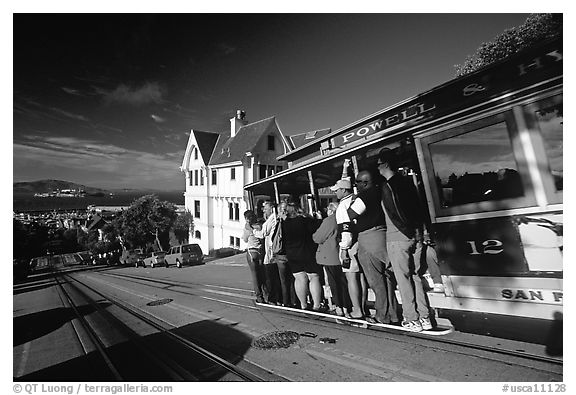 Cable car and Tudor house, Hyde Street, late afternoon. San Francisco, California, USA (black and white)