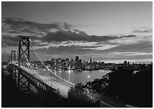 Bay Bridge and city skyline with lights at sunset. California, USA ( black and white)