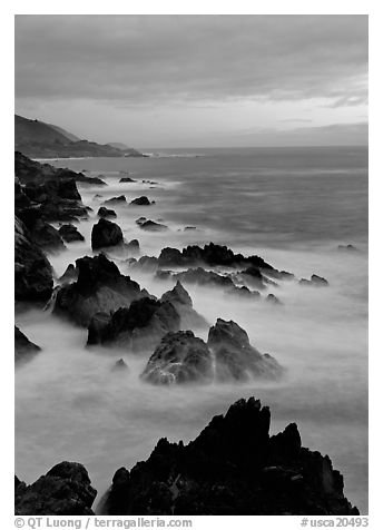 Rocks and surf near Rocky Cny Bridge, Garapata State Park, dusk. Big Sur, California, USA (black and white)