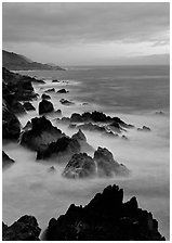 Rocks and surf near Rocky Cny Bridge, Garapata State Park, dusk. Big Sur, California, USA (black and white)