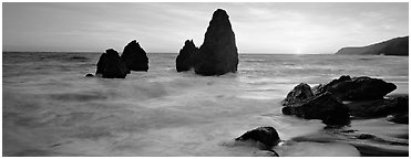 Sea stacks and setting sun, Rodeo Beach. California, USA (Panoramic black and white)