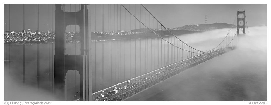 Fog rolling over Golden Gate Bridge. San Francisco, California, USA (black and white)