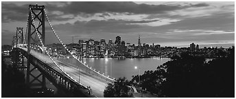 San Francisco cityscape and Bay Bridge at sunset. San Francisco, California, USA (Panoramic black and white)