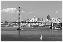 Sailboat, Golden Gate Bridge with city skyline, afternoon. San Francisco, California, USA (black and white)