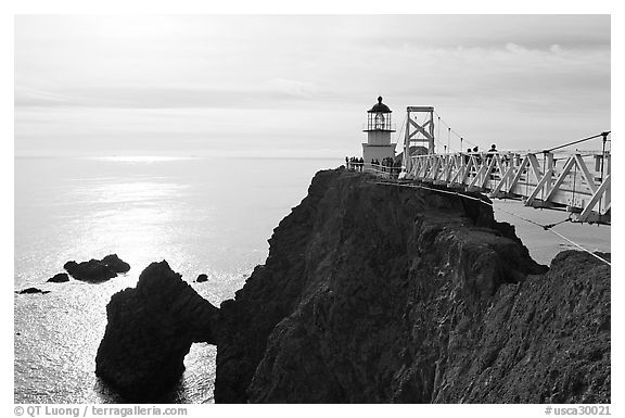 Narrow bridge leading to the Point Bonita Lighthouse, afternoon. California, USA (black and white)