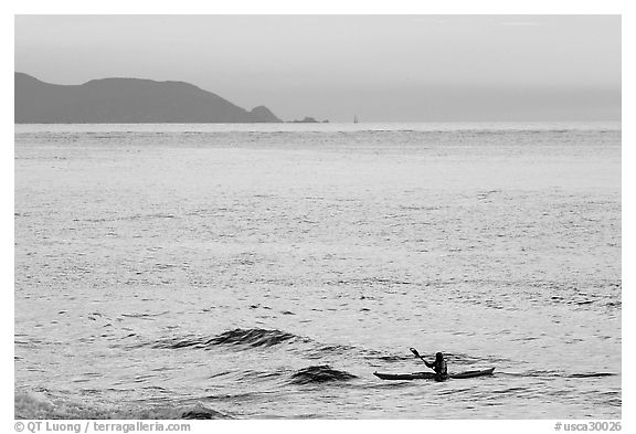 Sea kayaker, Rodeo Beach, sunset. California, USA