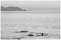 Sea kayaker, Rodeo Beach, sunset. California, USA (black and white)