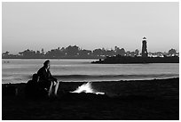 Camp Fire on the beach at sunset. Santa Cruz, California, USA ( black and white)