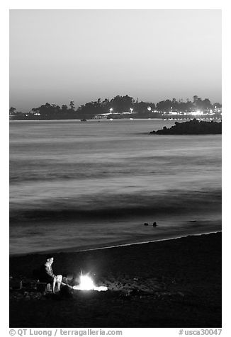Bonfire on the beach at sunset. Santa Cruz, California, USA (black and white)