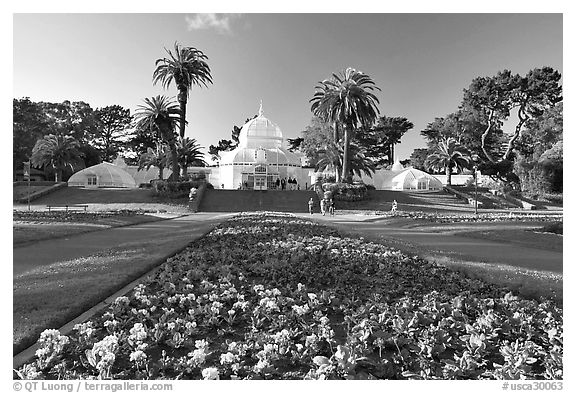 Flower bed and Conservatory of the Flowers, late afternoon, Golden Gate Park. San Francisco, California, USA