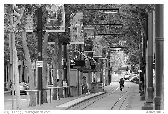 Downtown tree-lined street with tram lane. San Jose, California, USA