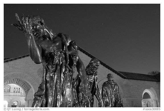 Burghers of Calais sculptures in  Quad at night. Stanford University, California, USA