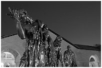 Burghers of Calais sculptures in  Quad at night. Stanford University, California, USA (black and white)