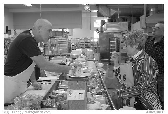 Choosing cheese at the Cheese Board. Berkeley, California, USA