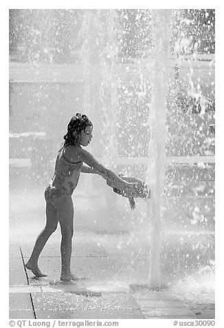 Girl refreshing herself, Cesar de Chavez Park. San Jose, California, USA (black and white)